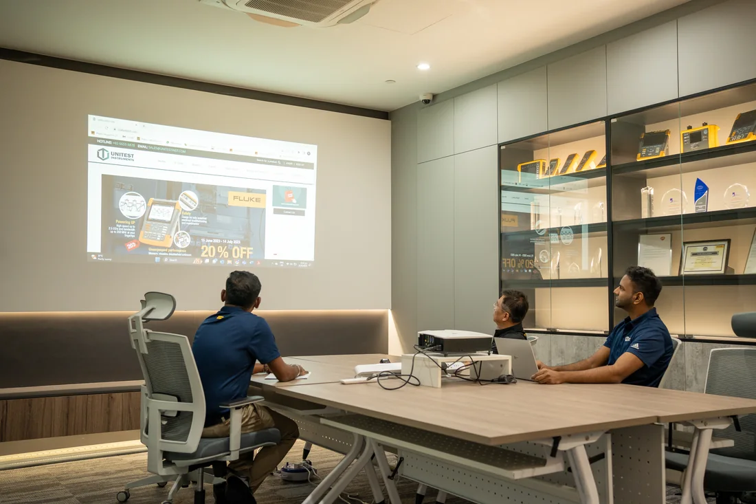 The Unitest team reviewing test & measurement content together in their Singapore office