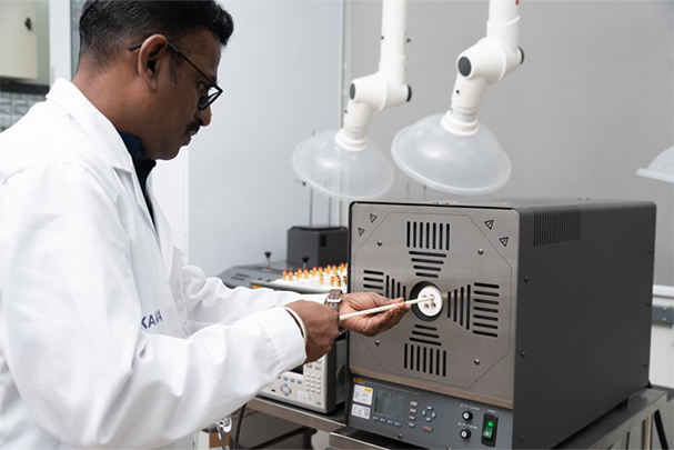 A Unitest technician calibrating equipment at a temperature calibration furnace